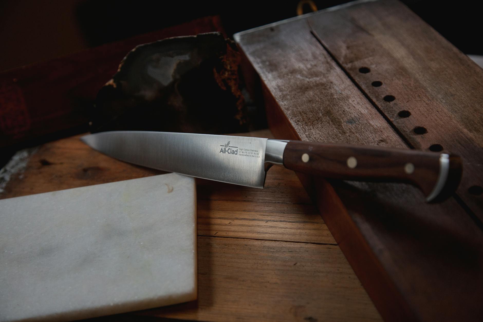 Japanese knife with wooden handle on cutting board